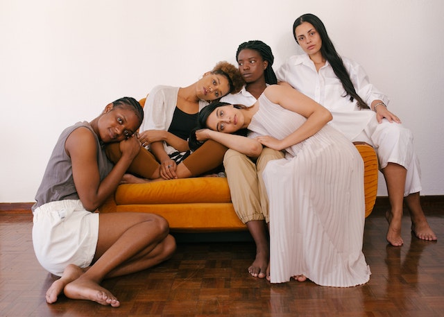 Photo of diverse group of women sitting on a couch for Facebook Ad copy portfolio piece by copywriter Valicia France
